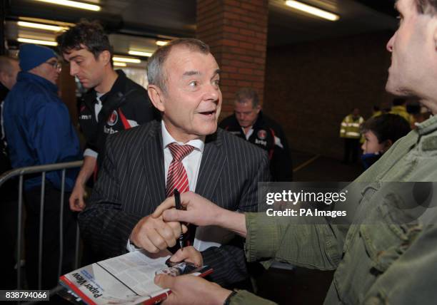 Charlton Athletic's caretaker Manager Keith Peacock signs an autograph for a fan during the npower League One match at Hillsborough, Sheffield.