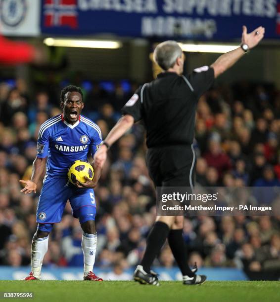 Chelsea's Michael Essien and referee Martin Atkinson
