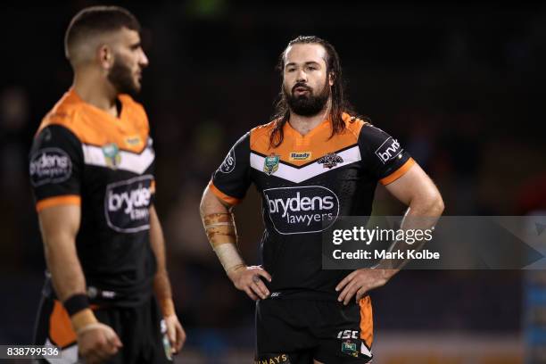 Aaron Woods of the Tigers looks dejected after defeat during the round 25 NRL match between the Wests Tigers and the North Queensland Cowboys at...