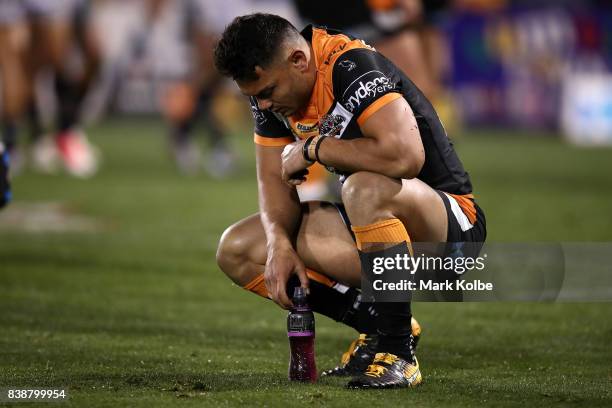 Esan Marsters of the Tigers looks dejected after defeat during the round 25 NRL match between the Wests Tigers and the North Queensland Cowboys at...