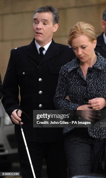 Police officer David Rathband arrives with his wife Katherine to give evidence in the Raoul Moat case at Newcastle Crown Court.