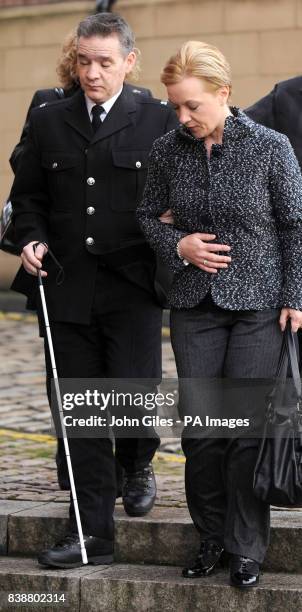 Police officer David Rathband arrives with his wife Katherine to give evidence in the Raoul Moat case at Newcastle Crown Court.