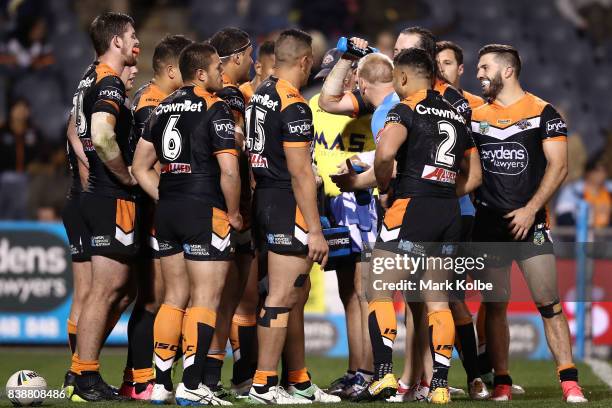 The Tigers look dejected after a Cowboys try during the round 25 NRL match between the Wests Tigers and the North Queensland Cowboys at Campbelltown...