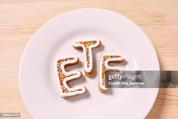 high angle view of etf letters on plate, symbol of investment in stocks - etf fotografías e imágenes de stock