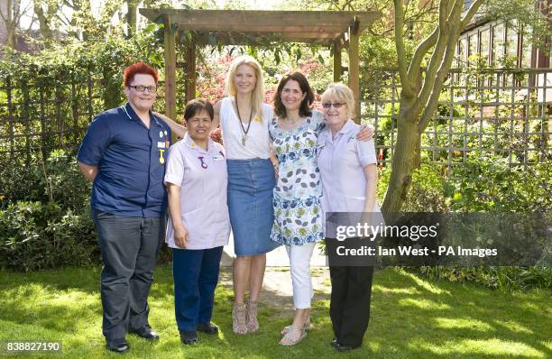 Gwyneth Paltrow with nurses Christopher McDonnell, Cely Lawson, organiser Sarah Wyn-Jones and Sylvia Gilbert-Smith, during a visit to the Marie Curie...