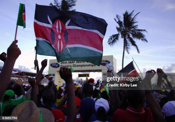 Fans wave Kenyan flags after the men's team victory in the 35th IAAF World Cross Country Championships at the Mombasa Golf Course in Mombasa, Kenya...