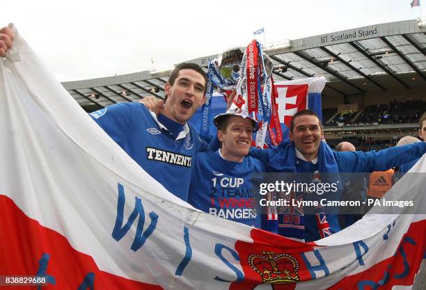 Rangers' Kyle Lafferty, Steven Davis and David Healy celebrate their victory with the trophy