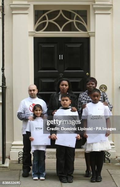 Saeed and Hannah Jan from Manchester, Jacqueline Robinson and Kyle Uzzell from Cardiff, and Julie and Josephine Henry from London, outside 11 Downing...