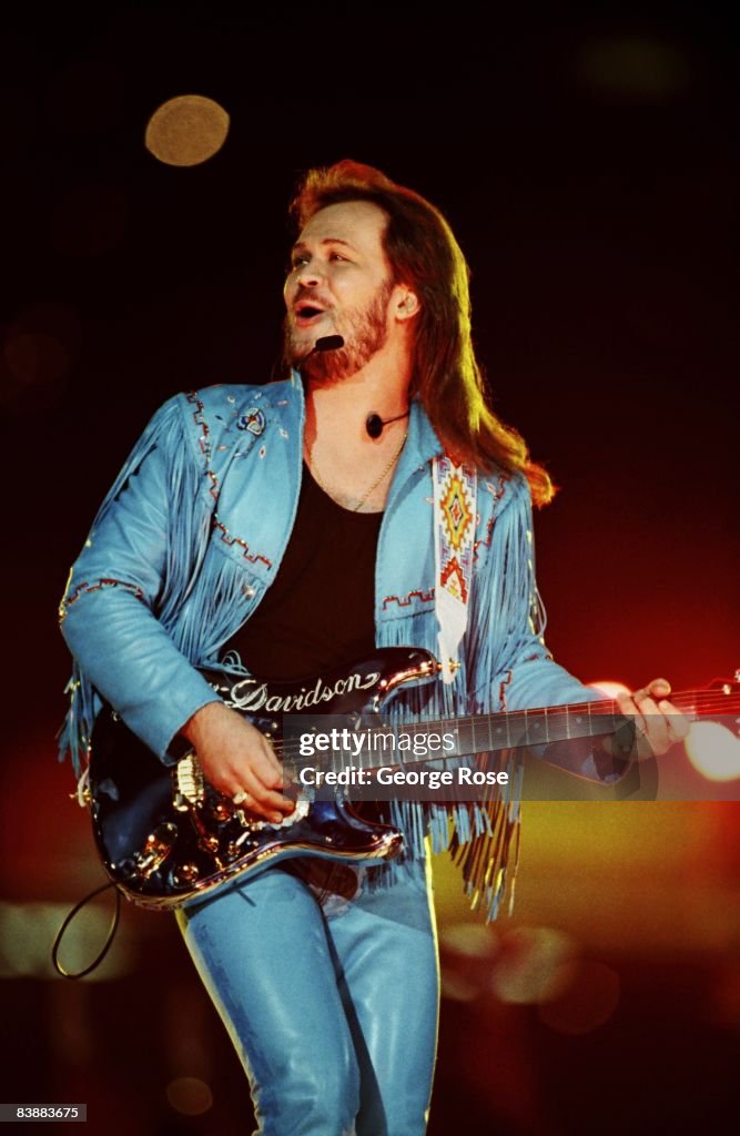 Tritt Country singer Travis Tritt performs during the half-time show at the ...