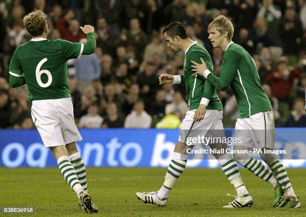 Republic of Ireland's Keith Fahey celebrates with team-mates after scoring his team's second goal.