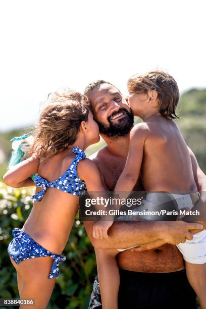 Tv presenter Cyril Hanouna is photographed with his children whilst on holiday for Paris Match on August 11, 2017 in Cannes, France.