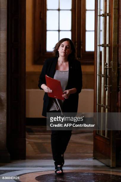Barcelona's mayor Ada Colau arrives to a press conference for an institutional statement to international media at the City Hall of Barcelona on...