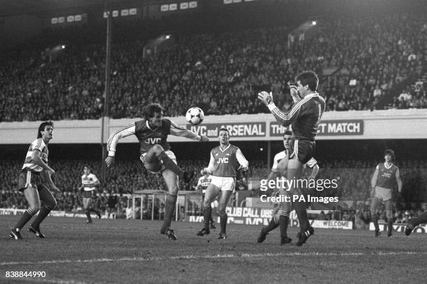 Arsenal's Martin hayes places his shot just wide of Queens Park Rangers goalkeeper David Seaman, watched by Arsenal's Perry Groves .