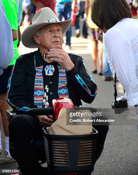 Former U.S. Senator Ben Nighthorse Campbell pauses to talk with visitors at the Santa Fe Indian Market in Santa Fe, New Mexico. The annual event,...