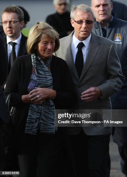 Former Manchester City player Colin Bell, centre right, arrives for the funeral of former manager Malcolm Allison, at Manchester Crematorium.