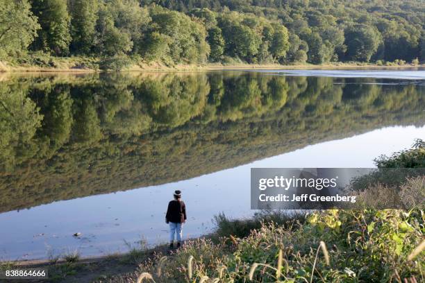 Woman looking out at Delaware River.