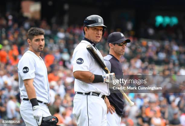 Nicholas Castellanos, Miguel Cabrera and manager Brad Ausmus of the Detroit Tigers look on during the game against the New York Yankees at Comerica...