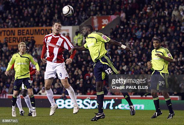 Stoke City's English forward Richard Cresswell heads the ball against Derby County's English defender Darren Powell during their English League Cup...