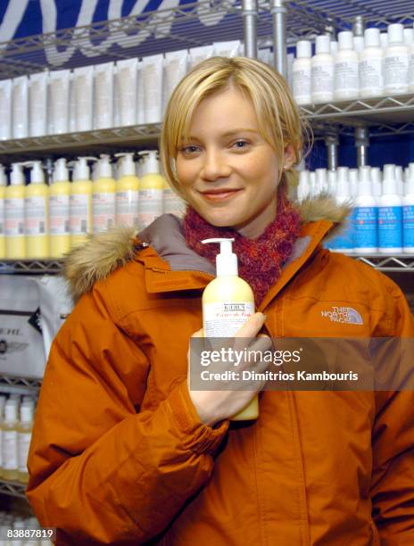 Amy Smart in front of Kiehl's display