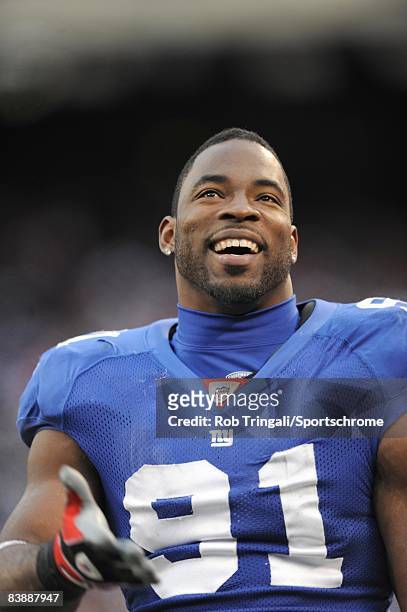 Defensive end Justin Tuck of the New York Giants looks on against the Baltimore Ravens on November 16, 2008 at Giants Stadium in East Rutherford, New...