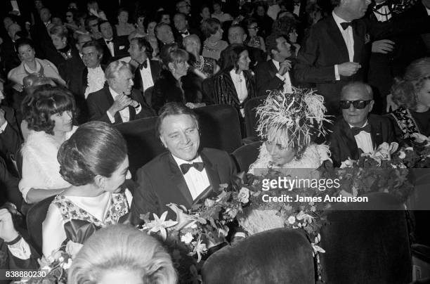 Maria Callas, Greek Opera singer , the british actor Richard Burton and the american actress Liz Taylor at the reception for the 75th birthday of the...