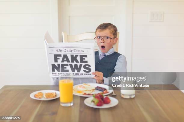 a young businessman reading fake news is shocked - media 2017 stock pictures, royalty-free photos & images