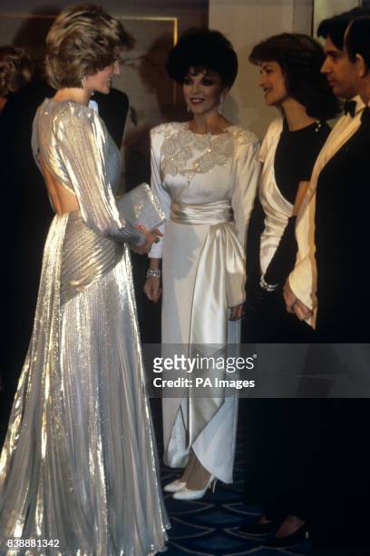 The Princess of Wales, wearing a Bruce Oldfield gown, being introduced to Jean Michel Jarre and Charlotte Rampling , second right), watched by...