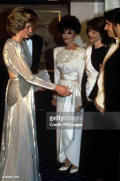 The Princess of Wales, wearing a Bruce Oldfield gown, being introduced to Jean Michel Jarre and Charlotte Rampling , second right, watched by actress...