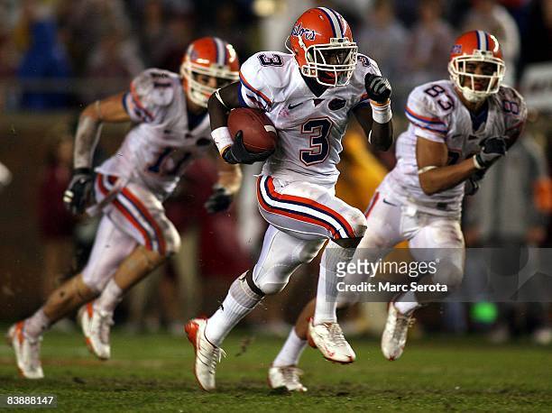 Running back Chris Rainey of the Florida Gators runs the ball against the Florida State Seminoles at Bobby Bowden Field at Doak Campbell Stadium on...