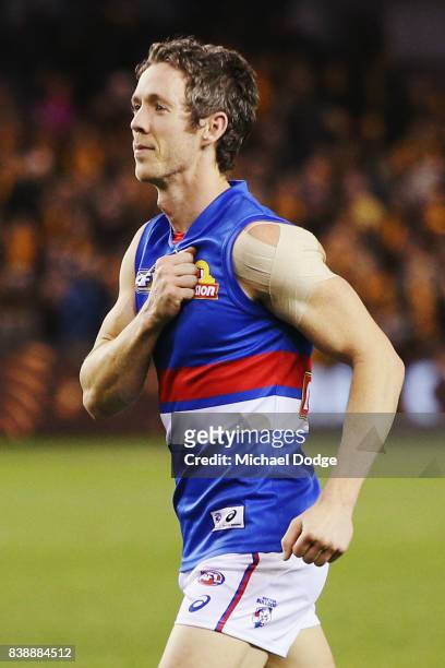 Robert Murphy of the Bulldogs beats his chest to fans after his retirement match during round 23 AFL match between the Hawthorn Hawks and the Western...
