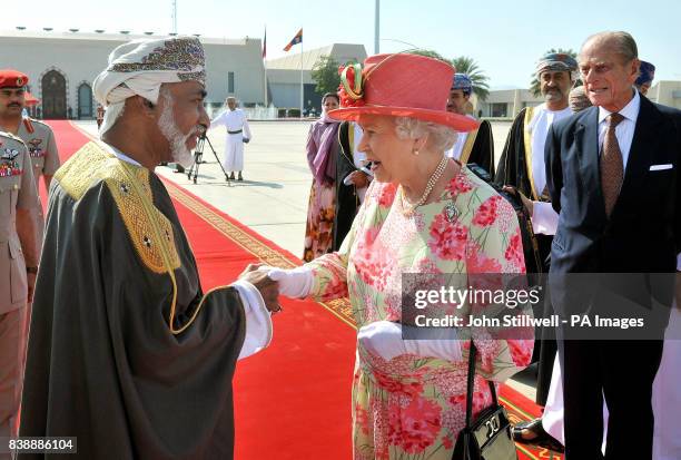 Queen Elizabeth II shakes hands with the Sultan of Oman, His Majesty Sultan Qaboos bin Said, before she and the Duke of Edinburgh depart Muscat...