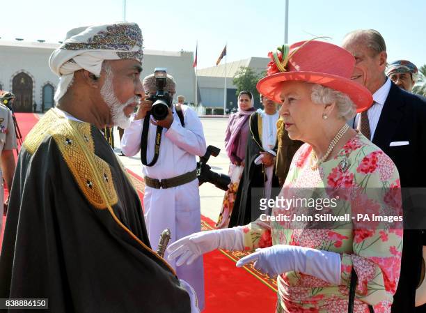 Queen Elizabeth II shakes hands with the Sultan of Oman, His Majesty Sultan Qaboos bin Said, before she and the Duke of Edinburgh depart Muscat...