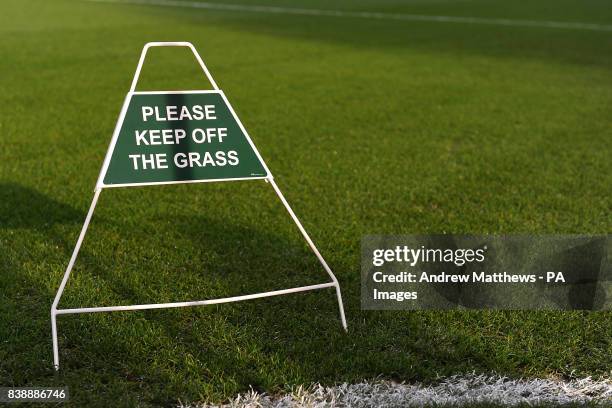 General view of a keep off the grass sign at Craven Cottage
