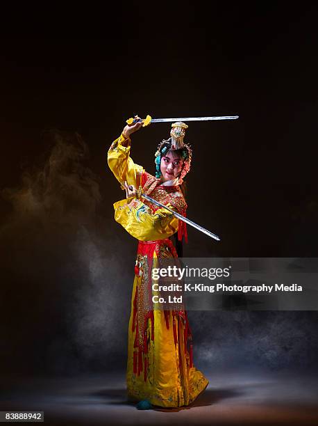 chinese opera character with knives (yu ji) - chinese opera makeup stock pictures, royalty-free photos & images