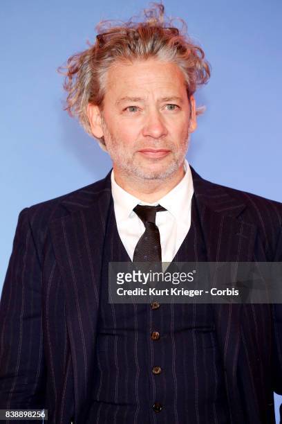 Image has been digitally retouched.) Dexter Fletcher attends the 'Eddie the Eagle' premiere in Munich, Germany on March 20, 2016.
