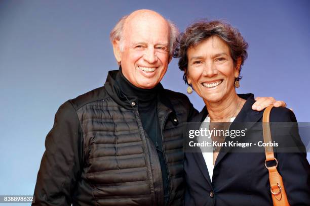 Image has been digitally retouched.) Willy Bogner and wife Sonia Bogner arrive at the 'Eddie the Eagle' premiere on March 20, 2016 in Munich, Germany.