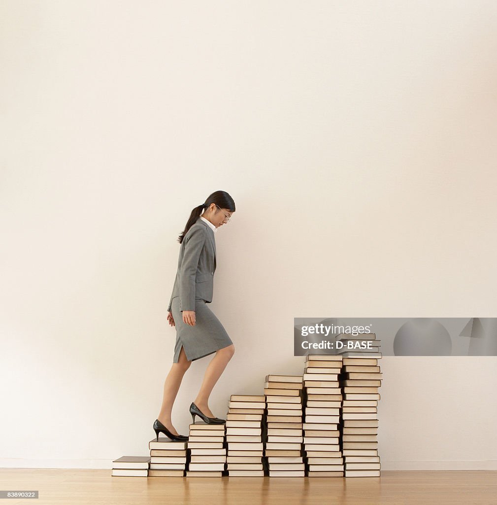 Business woman  walking up steps