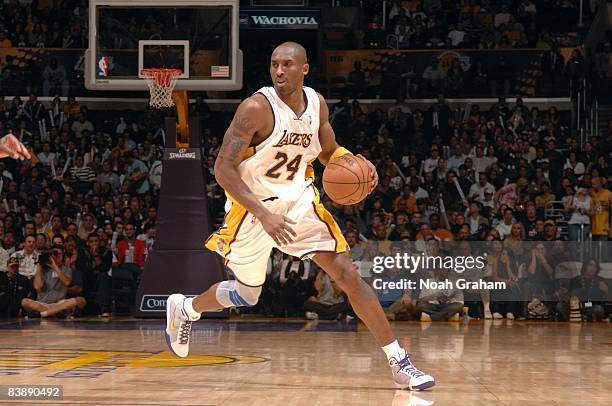 Kobe Bryant of the Los Angeles Lakers moves the ball up court during the game against the Sacramento Kings at Staples Center on November 23, 2008 in...