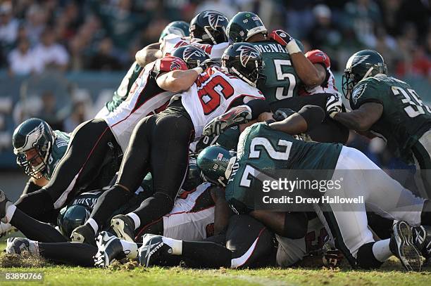 The Atlanta Falcons defense stops quarterback Donovan McNabb of the Philadelphia Eagles during a goal line stand on October 26, 2008 at Lincoln...