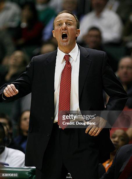 Head coach Thad Matta of the Ohio State Buckeyes yells out to his team while taking on the Miami Hurricanes at BankUnited Center on December 2, 2008...