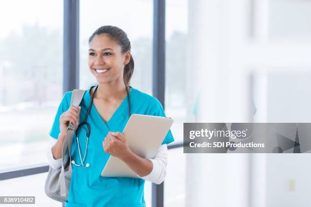 confident medical student walks to class - medical student stock pictures, royalty-free photos & images