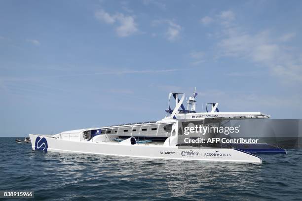 The self-energy producing multihull "Energy Observer" sails off the coast of Dinard, western France, on August 25, 2017. The "Energy Observer", an...