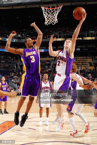 Goran Dragic of the Phoenix Suns lays the ball up against Trevor Ariza of the Los Angeles Lakers during the game on November 20, 2008 at US Airways...