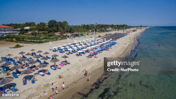 Drone images of Korinos Beach in Katerini, in Northern Greece on 25 August 2017 with golden clean sand, transparent green - blue water and relaxed...