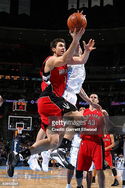 Andrea Bargnani of the Toronto Raptors goes to the basket against the Denver Nuggets on December 2, 2008 at the Pepsi Center in Denver, Colorado....