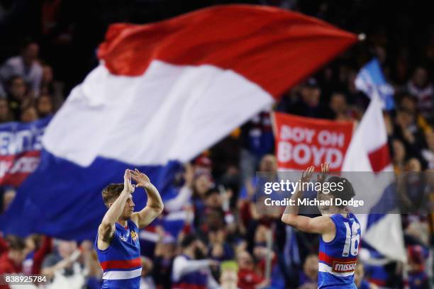 Matthew Boyd of the Bulldogs celebrates a goal with Toby McLean of the Bulldogs during round 23 AFL match between the Hawthorn Hawks and the Western...