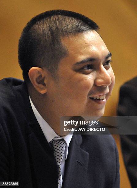 Mikey Arroyo Congressman and son of Philippine President Gloria Arroyo chats with colleagues as the house of representatives junks the latest...