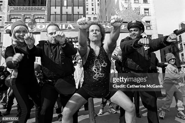 American fitness guru Richard Simmons, center, is joined by two policemen and others in an outdoor workout session sponsored by the California Raisin...