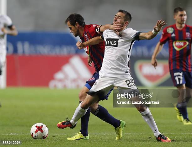 Danko Lazovic of Videoton FC and Milan Radin of FK Partizan in action during the UEFA Europa League Play-offs 2nd Leg match between Videoton FC and...