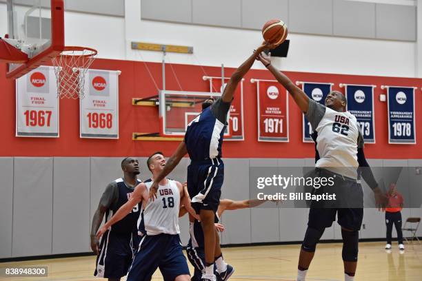 Reggie Williams and Jonathan Holmes of the USA AmeriCup Team go up for a rebound during a training camp at the University of Houston in Houston,...